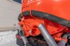 Обогревом лючка выхлопными газами